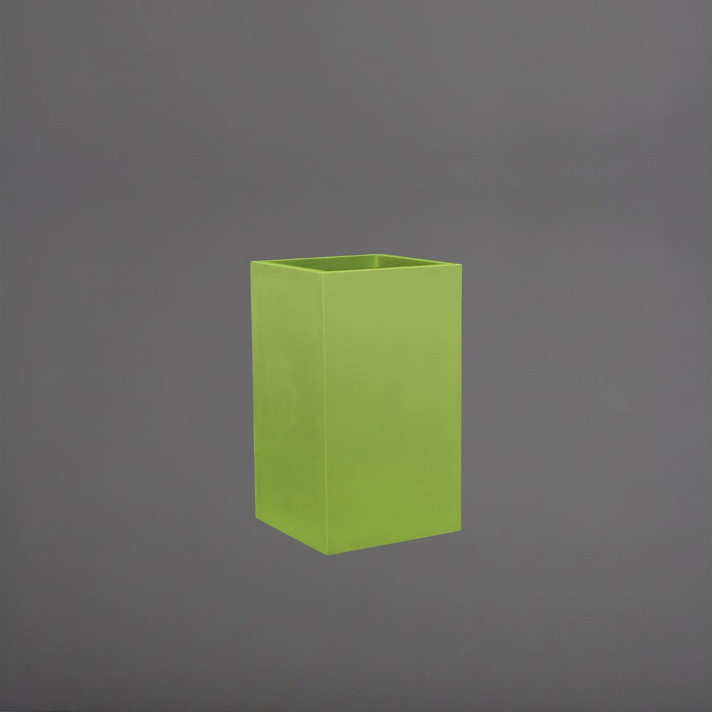 Tolga Corner Fiberglass Planter in satin green against gray background.