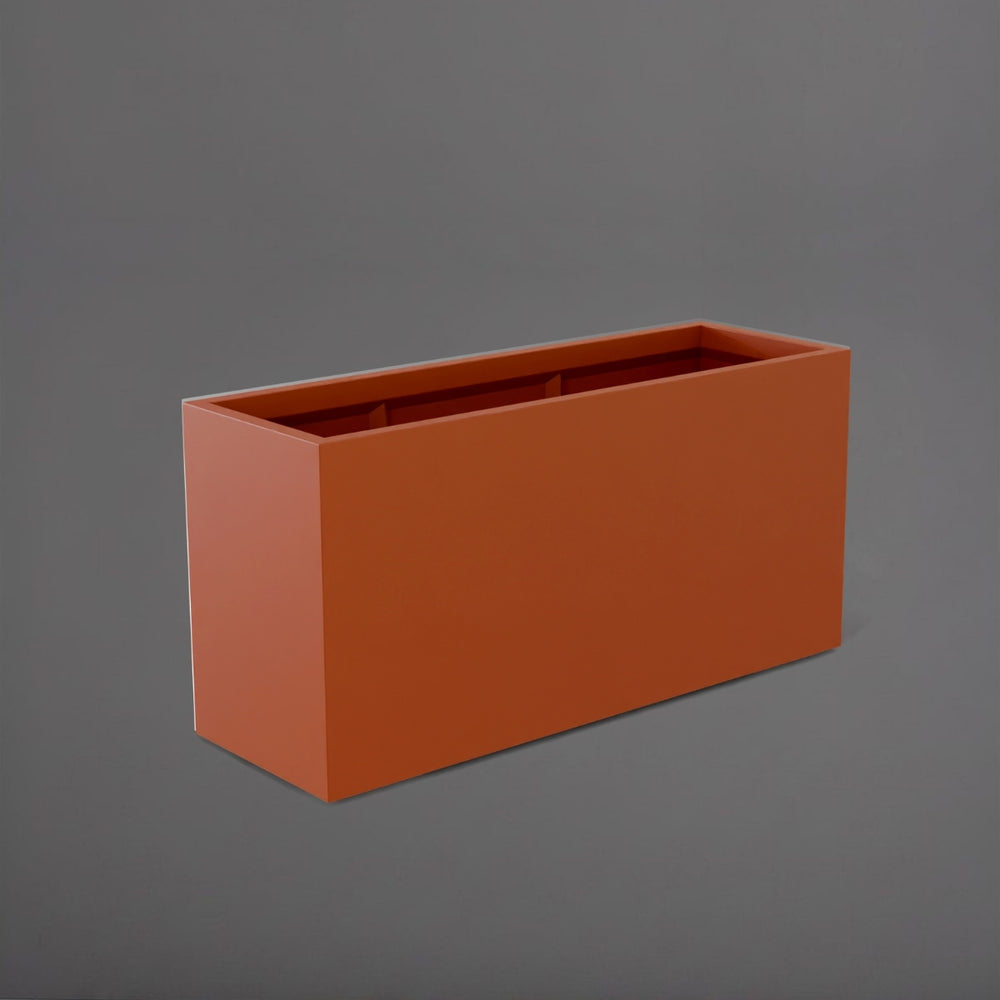 Tolga Rectangle Fiberglass Planter in matte terra cotta against gray background.