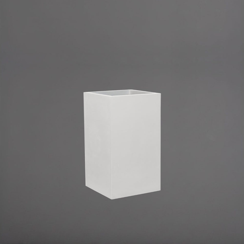 Torino Corner Fiberglass Planter in matte bright white against gray background.