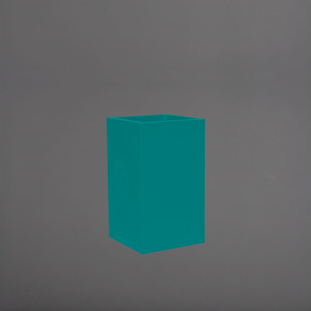 Torino Corner Fiberglass Planter in satin seafoam green against gray background.