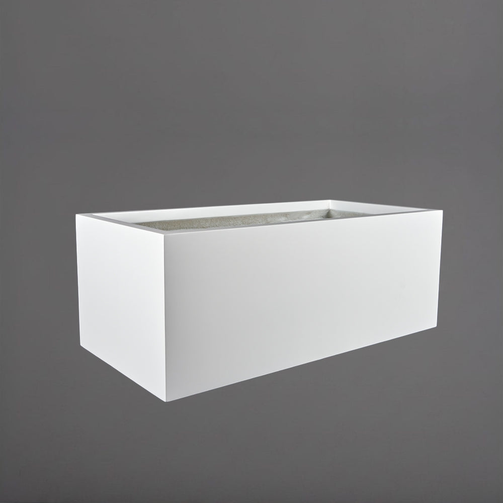 Torino Wide Rectangle Fiberglass Planter in matte bright white against gray background.
