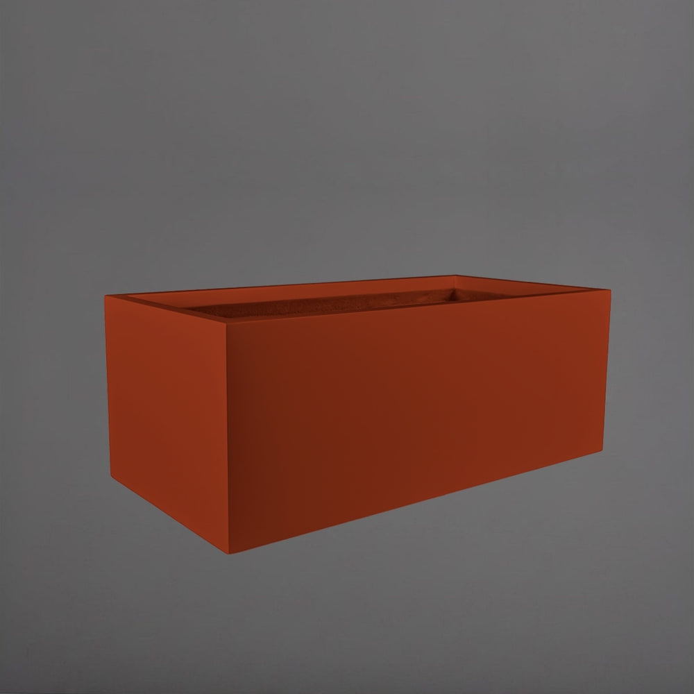 Torino Wide Rectangle Fiberglass Planter in matte terra cotta against gray background.