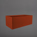 Torino Wide Rectangle Fiberglass Planter in matte terra cotta against gray background.