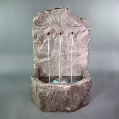 Tribus Rock Fountain  against gray background.