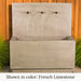 Tribus Wall Fountain in french limestone color agaisnt wooden fence.