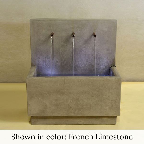 Tribus Wall Fountain in french limestone color in action.