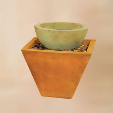 Two Tier Tapered Square Fountain against brown background.