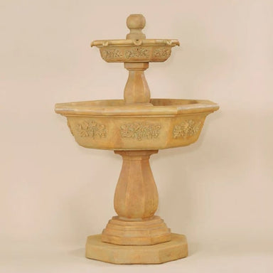 Uva Two Tier Fountain against brown background.