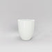 Valencia Tapered Round Fiberglass Planter in gloss bright white against gray background.