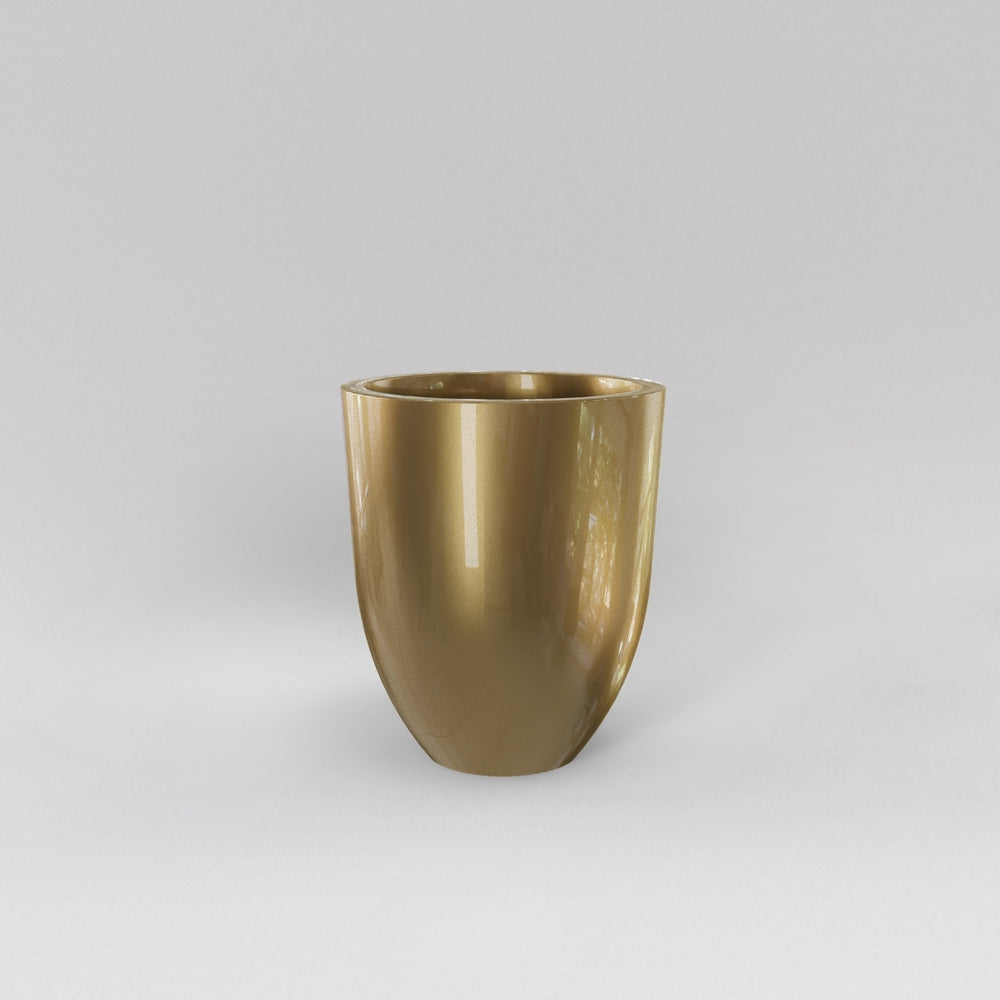 Valencia Tapered Round Fiberglass Planter in gloss metallic gold against gray background.