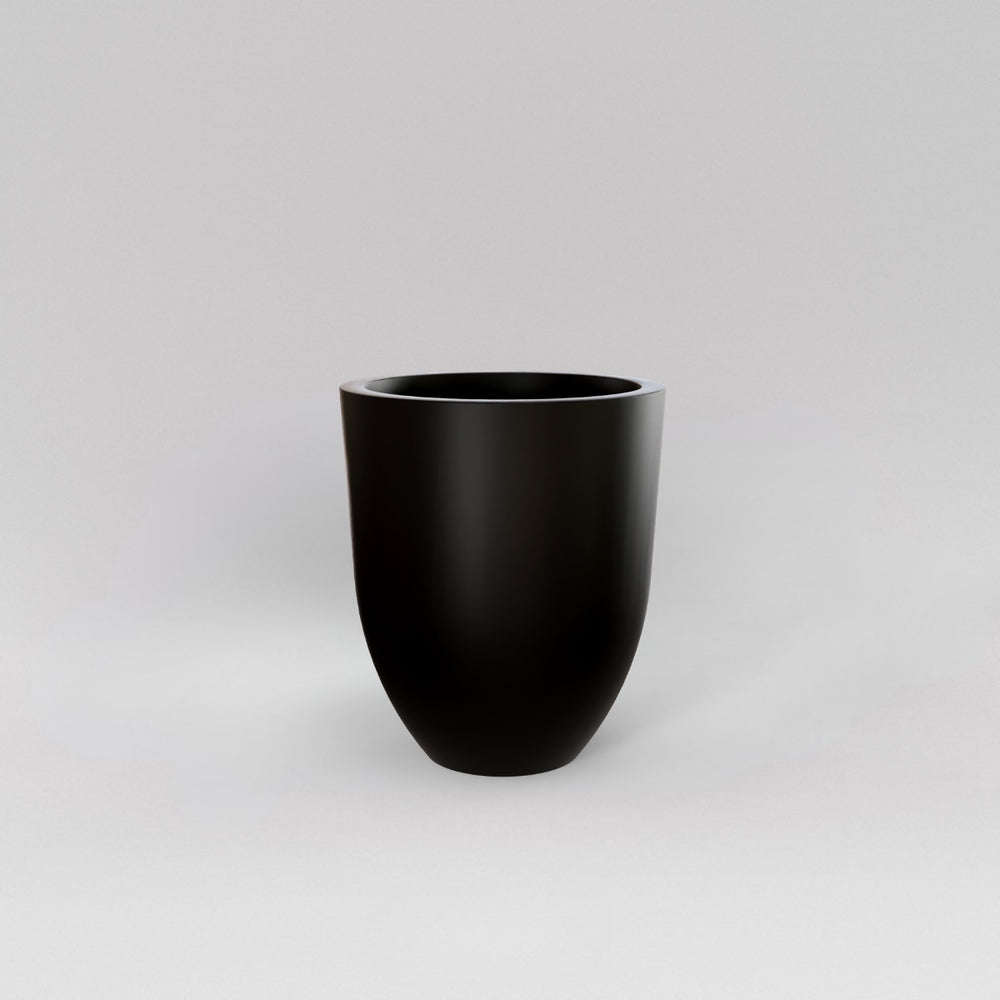 Valencia Tapered Round Fiberglass Planter in matte black against gray background.