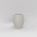 Valencia Tapered Round Fiberglass Planter in matte cement grey against gray background.
