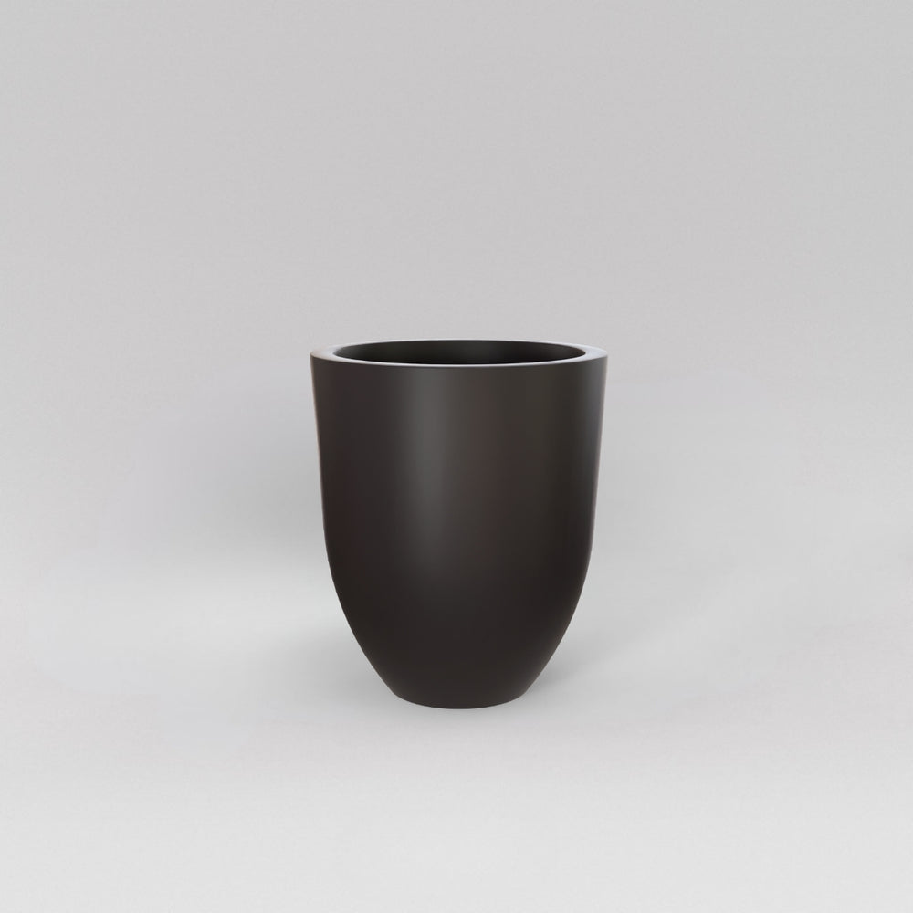 Valencia Tapered Round Fiberglass Planter in matte charcoal against gray background.