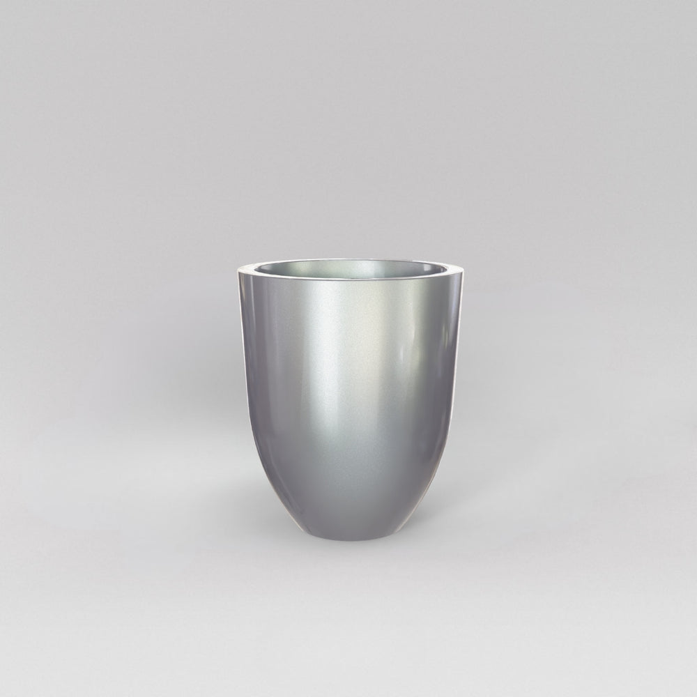 Valencia Tapered Round Fiberglass Planter in metallic silver against gray background.