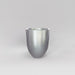 Valencia Tapered Round Fiberglass Planter in metallic silver against gray background.