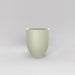 Valencia Tapered Round Fiberglass Planter in satin beige against gray background.