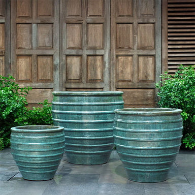 Vari Planter Set of 3 in Antique Jade on concrete in the backyard.
