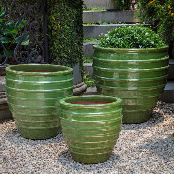 Vari Planter Set of 3 in Erin Green on concrete in the backyard.