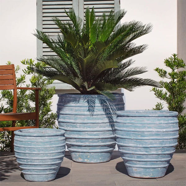 Vari Planter Set of 3 in Marano Celeste on concrete in the backyard.