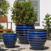 Vari Planter Set of 3 in Riviera Blue on concrete in the backyard.