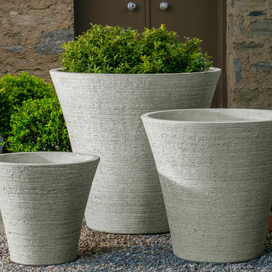Verve Planter, Large on gravel filled with plants.