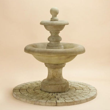 Villa Santini Two Tier Fountain against brown background.