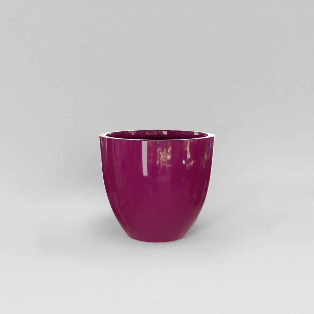 Wannsee Extra Large Round Fiberglass Planter in gloss eggplant against gray background.