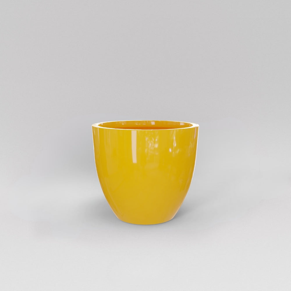 Wannsee Extra Large Round Fiberglass Planter in gloss saffron against gray background.
