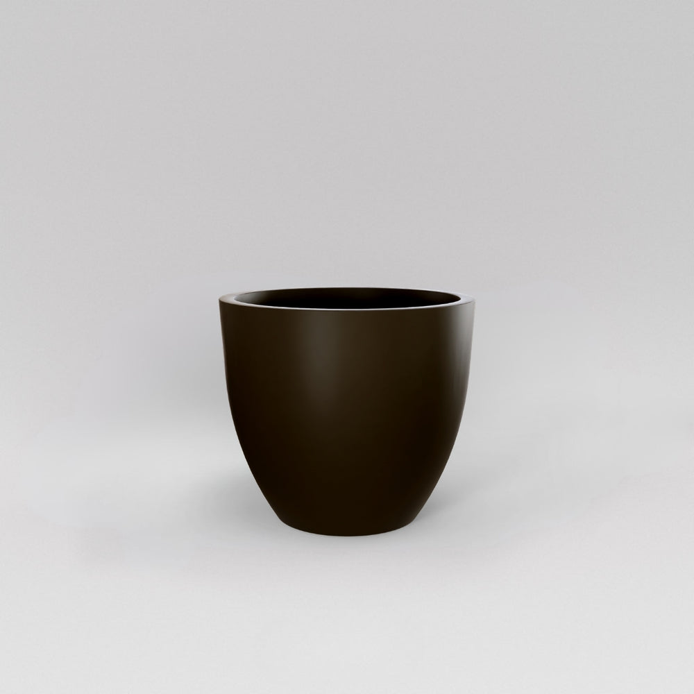 Wannsee Extra Large Round Fiberglass Planter in matte bronze against gray background.