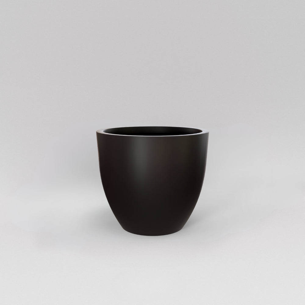 Wannsee Extra Large Round Fiberglass Planter in matte charcoal against gray background.