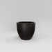 Wannsee Extra Large Round Fiberglass Planter in matte charcoal against gray background.