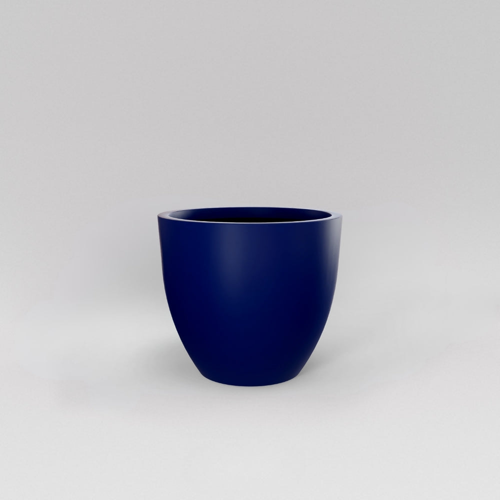 Wannsee Extra Large Round Fiberglass Planter in matte cobalt blue against gray background.