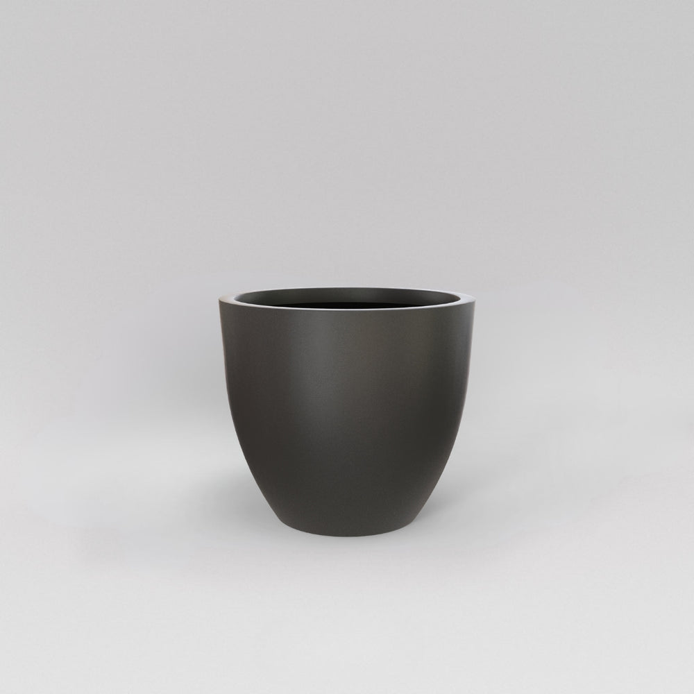 Wannsee Extra Large Round Fiberglass Planter in matte gunmetal against gray background.