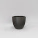 Wannsee Extra Large Round Fiberglass Planter in matte gunmetal against gray background.