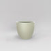 Wannsee Extra Large Round Fiberglass Planter in satin beige against gray background.