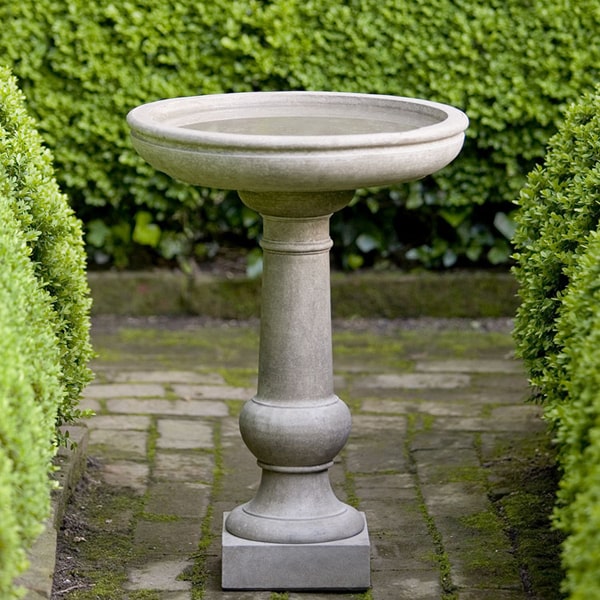 Williamsburg Tea Table Birdbath on concrete in the backyard