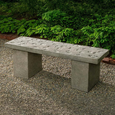 Woodland Leaves Bench on gravel in the backyard.