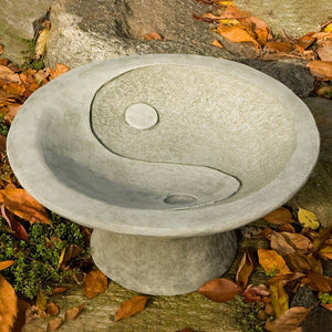 Yin Yang Pedestal Birdbath on concrete in the backyard