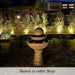 Zen Fountain Tall 2 Tier on concrete in the backyard nightview.
