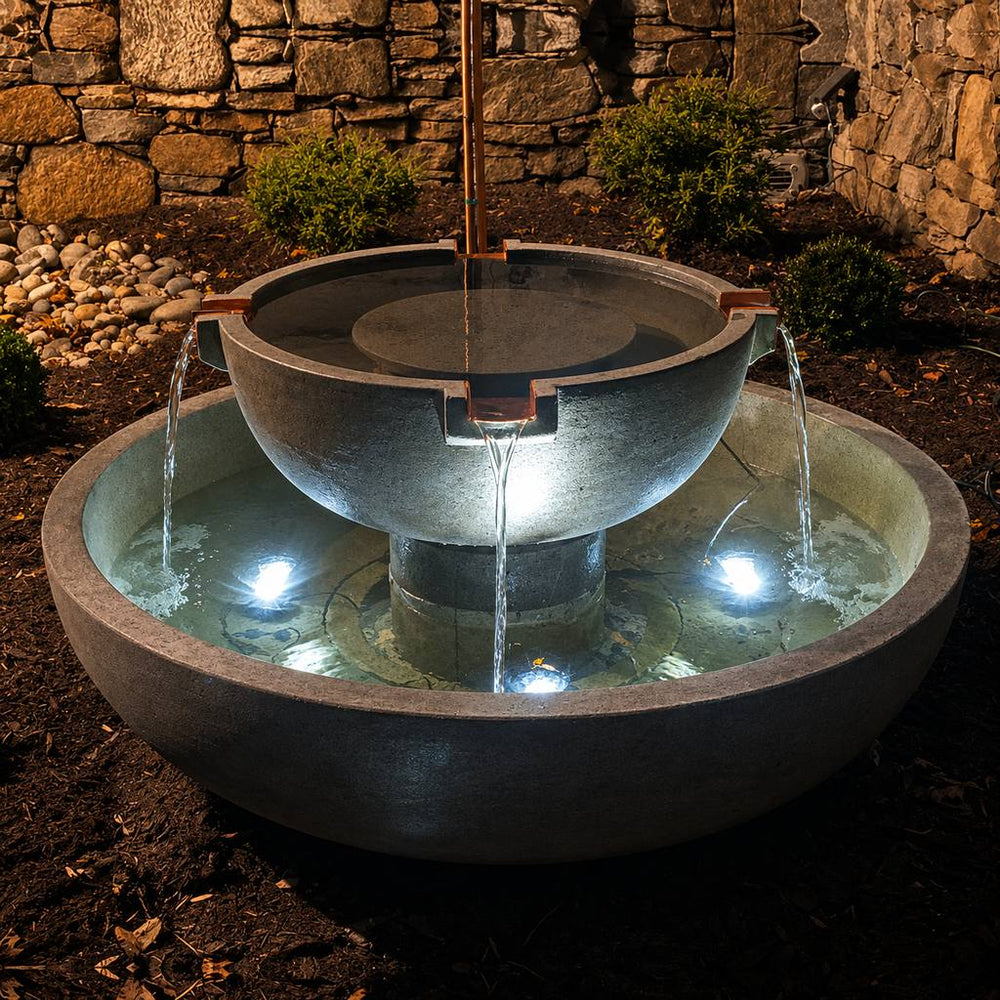 Campania Del Rey Fountain with 3 led lights shining at night.