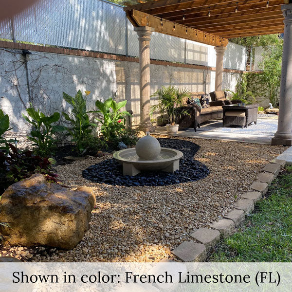 Campania Low Zen Sphere fountain on black gravel in backyard running