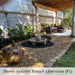 Campania Low Zen Sphere fountain on black gravel in backyard running