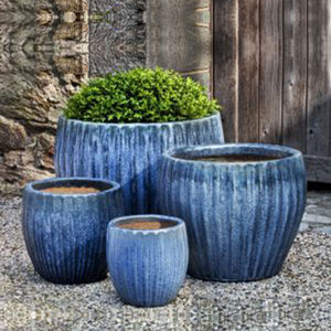 Andromeda Planter - Blue Pearl - Set of 4 on gravel in the backyard
