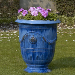 Anduze Urn - Riviera Blue - S/3 on grass filled with purple flowers