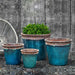 Baia Planter - Beachcomber Aqua - Set of 4 on gravel in the backyard