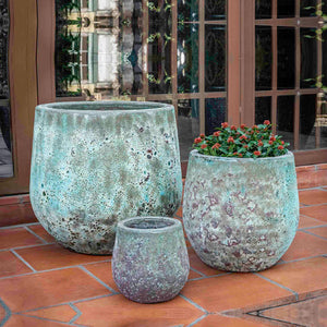 Baleares Planter Verdigris S/3 filled with plants on patio