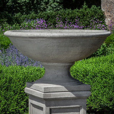 Beauport Urn on pedestal in the backyard upclose