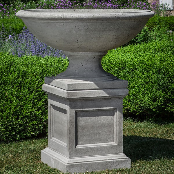 Beauport Urn on pedestal in the backyard