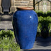 Binjai Jar Planter - Rustic Blue S/1 beside grass in the backyard