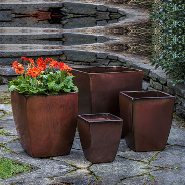 Blake Planter - Maple Red - S/4 filled with orange flowers in the backyard